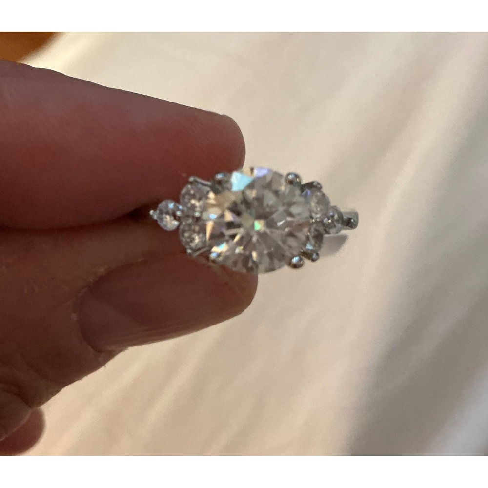 2.0-carat moissanite three-stone engagement ring in silver metal band size 7